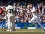 Australia's David Warner looks on as England's Stuart Broad celebrates after taking his wicket caught by Zak Crawley