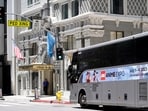 A shuttle bus picks up visiting Anime Expo tourists staying at downtown hotels outside The Biltmore Los Angeles hotel on Sunday, July 2, 2023, in downtown Los Angeles. Thousands of hotel workers in Southern California walked off the job on Sunday, demanding higher pay and better benefits in what the union is calling the largest strike in its history. (AP)