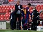 Barcelona's former captain Lionel Messi and former manager Ronald Koeman.