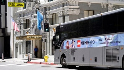 A shuttle bus picks up visiting Anime Expo tourists staying at downtown hotels outside The Biltmore Los Angeles hotel on Sunday, July 2, 2023, in downtown Los Angeles. Thousands of hotel workers in Southern California walked off the job on Sunday, demanding higher pay and better benefits in what the union is calling the largest strike in its history. (AP) A shuttle bus picks up visiting Anime Expo tourists staying at downtown hotels outside The Biltmore Los Angeles hotel on Sunday, July 2, 2023, in downtown Los Angeles. Thousands of hotel workers in Southern California walked off the job on Sunday, demanding higher pay and better benefits in what the union is calling the largest strike in its history. (AP)