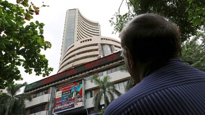 A man looks at a screen across a road displaying the Sensex on the facade of the Bombay Stock Exchange (BSE) building in Mumbai, India. (File image) (REUTERS)