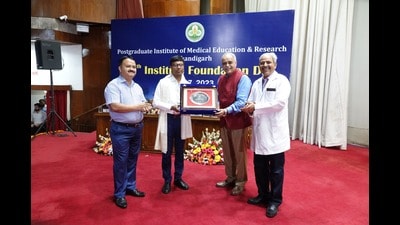 PGIMER director Dr Vivek Lal felicitating AIIMS director Chandigarh Dr M Srinivas during PGIMER’s 60th Foundation Day celebrations in Chandigarh on Friday.