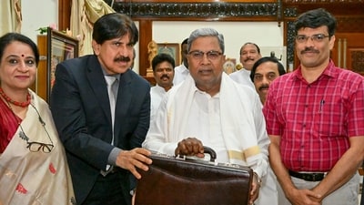 Karnataka Chief Minister Siddaramaiah arrives to present the first state Budget of his government in Assembly, in Bengaluru, Friday, (PTI) Karnataka Chief Minister Siddaramaiah arrives to present the first state Budget of his government in Assembly, in Bengaluru, Friday, (PTI)