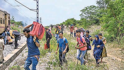 Passengers deboard the Falaknama Express train after it caught fire, in Yadadri Bhuvanagiri district, Telangana on Friday. (PTI) Passengers deboard the Falaknama Express train after it caught fire, in Yadadri Bhuvanagiri district, Telangana on Friday. (PTI)