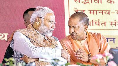 Prime Minister Narendra Modi and chief minister Yogi Adityanath have a chat during Gita Press centenary event in Gorakhpur on Friday. (PTI PHOTO) Prime Minister Narendra Modi and chief minister Yogi Adityanath have a chat during Gita Press centenary event in Gorakhpur on Friday. (PTI PHOTO)