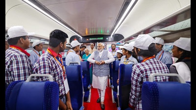 Prime Minister Narendra Modi interacts with students in a Vande Bharat Express in Gorakhpur on Friday. (PTI)