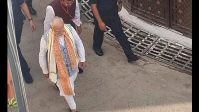 Prime Minister Narendra Modi walks towards the residence of MoS Pankaj Chaudhary in Gorakhpur, on Friday (Sourced)