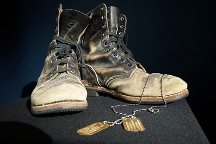 Combat boots and dog tags worn by Alan Alda as he portrayed the wisecracking surgeon Hawkeye on the beloved television series "M-A-S-H" are displayed at Heritage Auctions in Irving, Texas, Wednesday, July 5, 2023. The items are up auction on July 28. (AP Photo/LM Otero) (AP) Combat boots and dog tags worn by Alan Alda as he portrayed the wisecracking surgeon Hawkeye on the beloved television series "M-A-S-H" are displayed at Heritage Auctions in Irving, Texas, Wednesday, July 5, 2023. The items are up auction on July 28. (AP Photo/LM Otero) (AP)