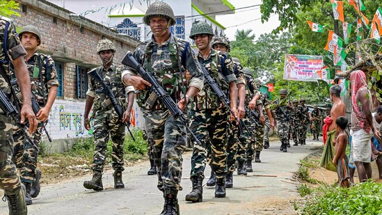 Nadia: Security personnel conduct a route march ahead of the West Bengal panchayat polls, in Nadia, Friday. (PTI)