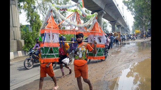 To address any incidents of Kanwarias’ Kanwars getting damaged or water being spilled during the journey, the police have procured 1200 liters of Ganga Jal from Haridwar. (Sakib Ali/HT Photo)