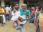 An elderly man is carried after he cast his vote for Panchayat elections at a polling station in Nadia district of West Bengal on Saturday, An elderly man is carried after he cast his vote for Panchayat elections at a polling station in Nadia district of West Bengal on Saturday,