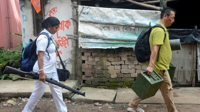Polling staff leave for their respective polling stations after collecting polling equipment and material from a distribution centre on the eve of West Bengal panchayat election, in North 24 Parganas on Friday. (ANI Photo)