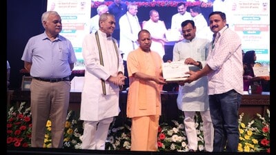 Achal Kumar Mishra (extreme right) was felicitated by chief minister Yogi Adityanath for being one of the highest producers of cane in the state. (Sourced)