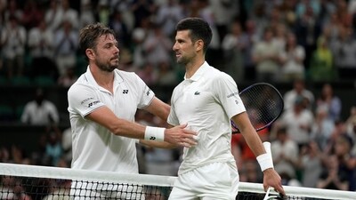 Serbia's Novak Djokovic, right, greets Switzerland's Stan Wawrinka at the net after beating him in a men's singles match on day five of the Wimbledon (AP) Serbia's Novak Djokovic, right, greets Switzerland's Stan Wawrinka at the net after beating him in a men's singles match on day five of the Wimbledon (AP)