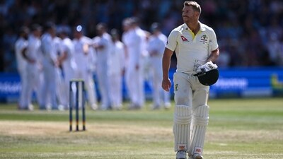 David Warner reacts as he walks back to the pavilion after losing his wicket for 1 (AFP)