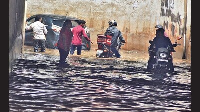 Commuters stranded in a waterlogged railway underpass in Sector 19, Panchkula, on Saturday. (Sant Arora/HT) Commuters stranded in a waterlogged railway underpass in Sector 19, Panchkula, on Saturday. (Sant Arora/HT)