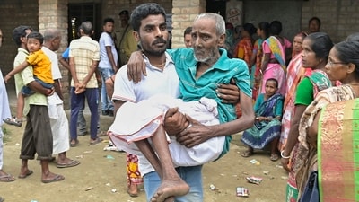 An elderly man is carried after he cast his vote for Panchayat elections at a polling station in Nadia district of West Bengal on Saturday, (PTI) An elderly man is carried after he cast his vote for Panchayat elections at a polling station in Nadia district of West Bengal on Saturday, (PTI)