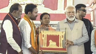 Prime Minister Narendra Modi being presented a memento by Union Minister G. Kishan Reddy during a public meeting in Telangana. (PTI) Prime Minister Narendra Modi being presented a memento by Union Minister G. Kishan Reddy during a public meeting in Telangana. (PTI)