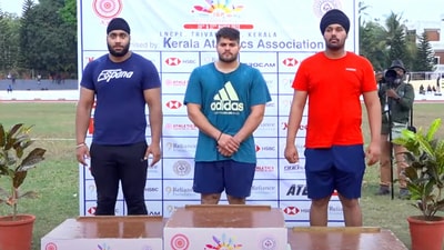 Karanveer Singh (middle) after victory in the Open Throws Competition earlier this year. Karanveer Singh (middle) after victory in the Open Throws Competition earlier this year.
