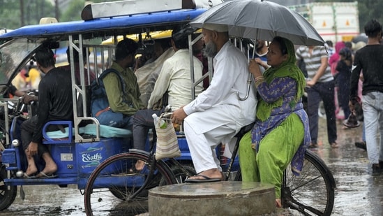 Many commuters faced hardships in reaching their destinations as moderate to heavy rain lashed Delhi and adjoining areas in the National Capital Region (NCR).&nbsp;(PTI)
