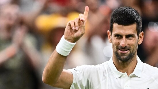 Serbia's Novak Djokovic celebrates winning against Stan Wawrinka during their men's singles tennis match on the fifth day of the 2023 Wimbledon (AFP)