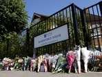 Floral tributes laid outside the school gate. 