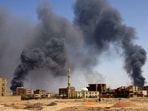Smoke rises above buildings after aerial bombardments during clashes between the paramilitary Rapid Support Forces and the army in Khartoum. 