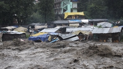 In another incident, six people were evacuated safely by a team of the State Disaster Response Force (SDRF) on Sunday who were trapped in their homes due to the rise in the water in the lower market of Pandoh in the Mandi district of Himachal Pradesh.&nbsp; (HT Photo/Aquil Khan)