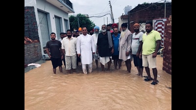 Chabbewal MLA Dr Raj Kumar taking stock of flood situation in Hoshiarpur`s Halluwal village in Sunday. (HT Photo)