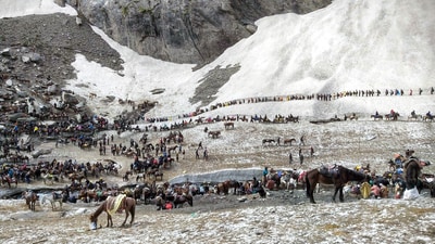 Pilgrims on their way to the holy cave shrine of Amarnath, in Jammu and Kashmir. (PTI) Pilgrims on their way to the holy cave shrine of Amarnath, in Jammu and Kashmir. (PTI)