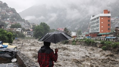 Swollen Beas river damages houses in Kullu, Himachal Pradesh, on Sunday. (AP)