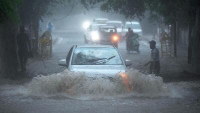 Vehicles wade through a waterlogged stretch under a railway bridge near Sarojini Nagar, in New Delhi on Sunday. (Sanjeev Verma/HT) Vehicles wade through a waterlogged stretch under a railway bridge near Sarojini Nagar, in New Delhi on Sunday. (Sanjeev Verma/HT)