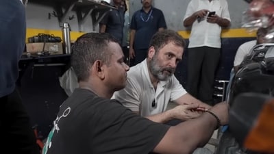 Rahul Gandhi as he services a bike and talks with mechanics in Delhi's Karol Bagh. Rahul Gandhi as he services a bike and talks with mechanics in Delhi's Karol Bagh.