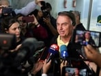 Brazil's former president Jair Bolsonaro speaks with media.