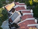 A view shows damaged houses, which were evacuated due to a growing fissure causing a landslide, in the Rolling Hills Estates, California,