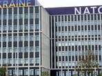 Ukraine and NATO signs are seen on a building in Vilnius, Lithuania July 10, 2023. (Reuters)