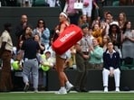 Victoria Azarenka reacts to spectators as she leaves the court after losing her fourth round match against Ukraine's Elina Svitolina