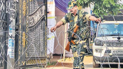 A security official stand guard outside a strong room where ballot boxes are kept after West Bengal's Panchayat polls. (PTI) A security official stand guard outside a strong room where ballot boxes are kept after West Bengal's Panchayat polls. (PTI)