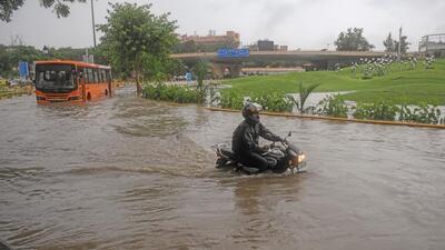 A severely waterlogged road in New Delhi on Sunday. (ANI) A severely waterlogged road in New Delhi on Sunday. (ANI)