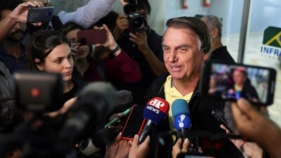 Brazil's former president Jair Bolsonaro speaks with media. (Reuters)