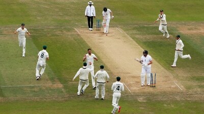 Mitchell Starc celebrates with teammates after bowling out Jonny Bairstow (Reuters)
