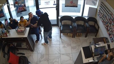 The image shows a man trying to rob a salon. (Facebook/Crime Stoppers Greater Atlanta)