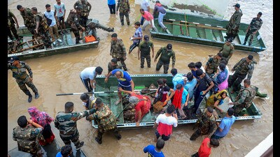 Indian Army personnel rescue people stuck in the flood-affected Sanauri Adda area after heavy monsoon rains caused rapid rise in the water level of Badi Nadi river, in Patiala district on Monday. (PTI) Indian Army personnel rescue people stuck in the flood-affected Sanauri Adda area after heavy monsoon rains caused rapid rise in the water level of Badi Nadi river, in Patiala district on Monday. (PTI)