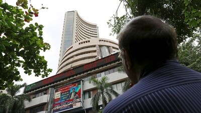 A man looks at a screen across a road displaying the Sensex on the facade of the Bombay Stock Exchange (BSE) building in Mumbai, India. (File image) (REUTERS)