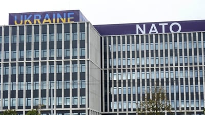 Ukraine and NATO signs are seen on a building in Vilnius, Lithuania July 10, 2023. (Reuters)