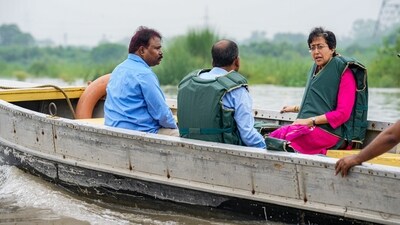 Delhi PWD Minister Atishi examines rising water levels of Yamuna river following intense monsoon rains in New Delhi on Monday. The Central Water Commission (CWC) warned that the water level is projected to surpass the danger mark of 205.33 meters on Tuesday. (PTI) Delhi PWD Minister Atishi examines rising water levels of Yamuna river following intense monsoon rains in New Delhi on Monday. The Central Water Commission (CWC) warned that the water level is projected to surpass the danger mark of 205.33 meters on Tuesday. (PTI)