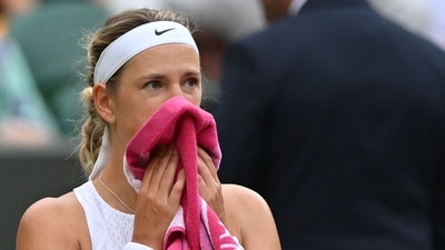 Belarus' Victoria Azarenka uses a towel during a break in play against Ukraine's Elina Svitolina during their women's singles tennis match on the seventh day of the 2023 Wimbledon Championships (AFP) Belarus' Victoria Azarenka uses a towel during a break in play against Ukraine's Elina Svitolina during their women's singles tennis match on the seventh day of the 2023 Wimbledon Championships (AFP)
