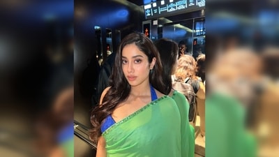 Janhvi Kapoor paired her parrot green saree with a contrasting blue textured halter blouse. (Instagram/@janhvikapoor) Janhvi Kapoor paired her parrot green saree with a contrasting blue textured halter blouse. (Instagram/@janhvikapoor)