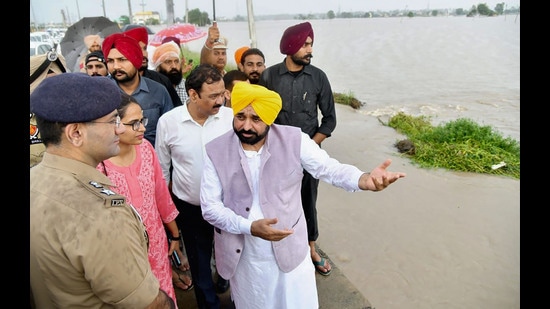 Punjab chief minister Bhagwant Mann takes stock of the relief and rescue measures being conducted at rain-affected areas in the state, on Monday. (PTI)