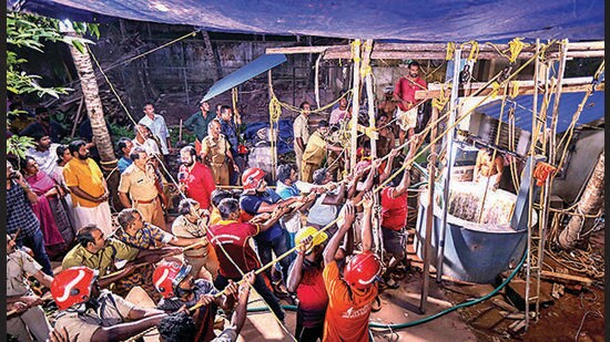 Thiruvananthapuram: The police and fire services officials try to rescue a 55-year-old man trapped under soil inside a well near Vizhinjam, in Thiruvananthapuram on July 9, 2023. (PTI)